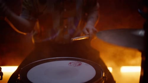 Talented Guy Playing Drum Making Beat at Rock Concert in Night Bar Closeup