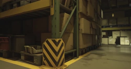 Warehouse Storage Area Showing Stacked Boxes and Safety Barriers