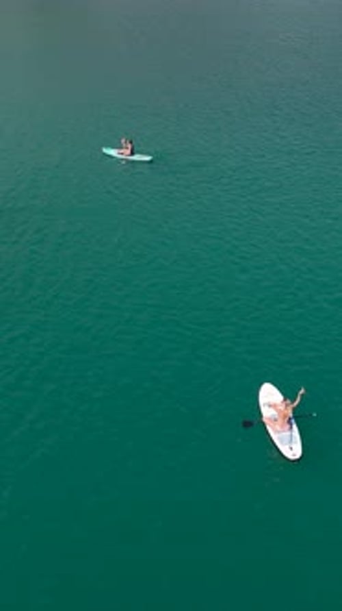 Vertical Video Paddleboarding Adventure With Friends in a Gorgeous Canyon Full of Beauty