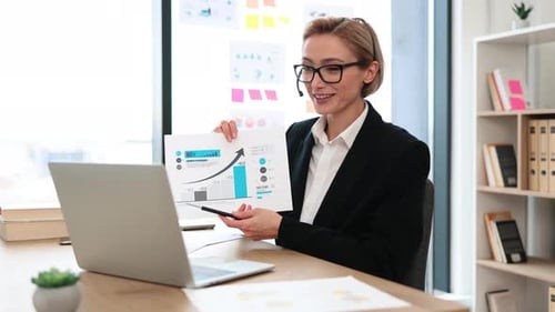 Woman Presents Chart in Video Conference Call