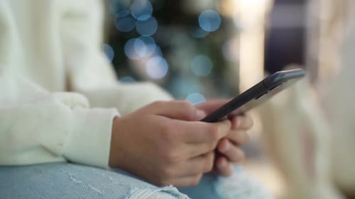 Closeup Face of Serious Bored Cute Little Girl Using Smartphone Watching Video Sitting Alone in