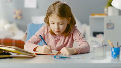 Diligent Young Girl Does Homework while Sitting in Her Room.