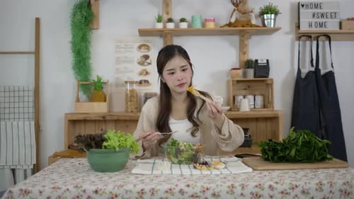 Young Woman Prepares and Enjoys a Healthy Salad
