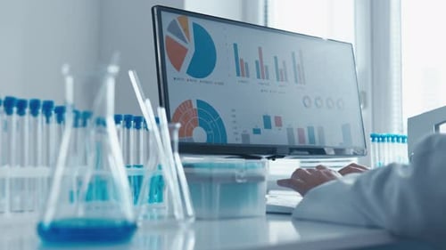 In a Wellequipped Lab a Skilled Scientist Analyzes Complex Data with Advanced Tools and Collaborates
