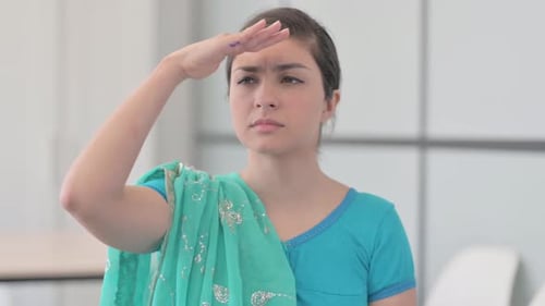 Portrait of Indian Woman in Sari Searching for Opportunity