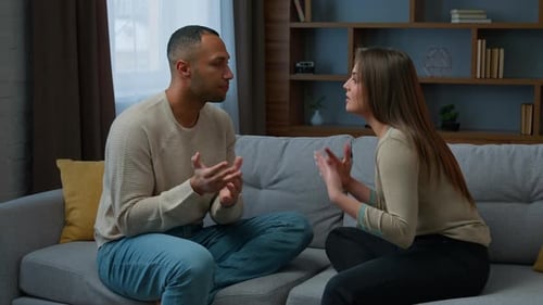 Couple Arguing on Couch
