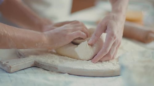 Mother Daughter Kneading Dough Together