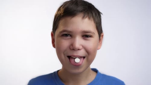 Tablet Lies on the Tongue of a Boy