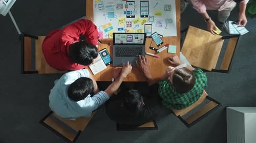 Top view of skilled manager using laptop working on Ux Ui design. Convocation.