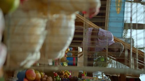 Black Man Buying Groceries At A Market In Africa - Vertical Shot