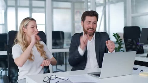 Two Caucasian Business Colleagues Finish Complete Laptop Task Dancing Giving High Five Successful