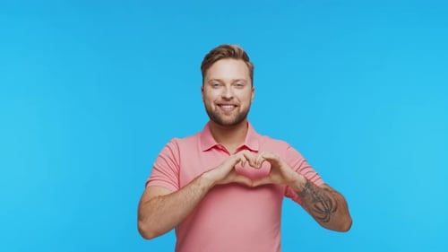 Expressive Young Man Over Vibrant Background Studio Portrait of Handsome Person