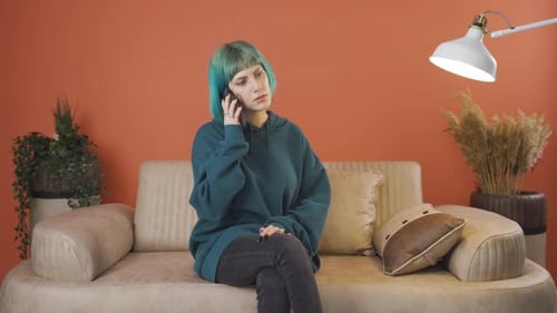 Woman Answering Phone Overwhelmed with Sadness and Emotion