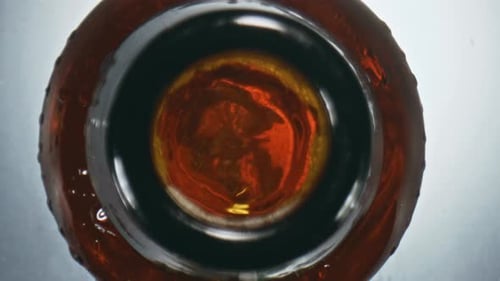 Golden Ipa Splashing Flask Top View. Closeup Cool Inebriant Liquid Bubbling In