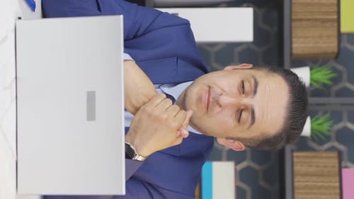 Professional Man In Office Talking To Computer