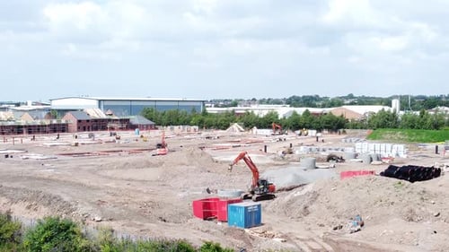 UK town housing development working foundation construction site aerial view