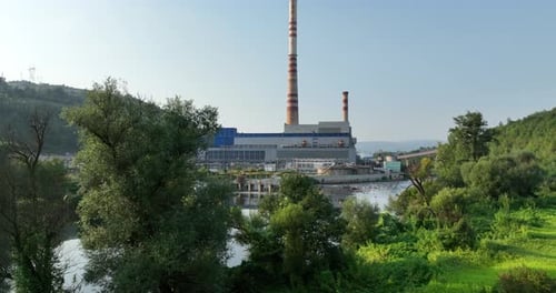 Aerial View of Coal Power Plant High Pipes with Black Smoke Moving Up Polluting Atmosphere at Sunset