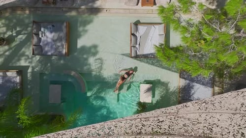 Aerial View Beautiful Model Enjoying BaliInspired Interiors in a Beach Club