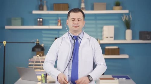 Professional Doctor Puts on Stethoscope and Gives Thumbs Up