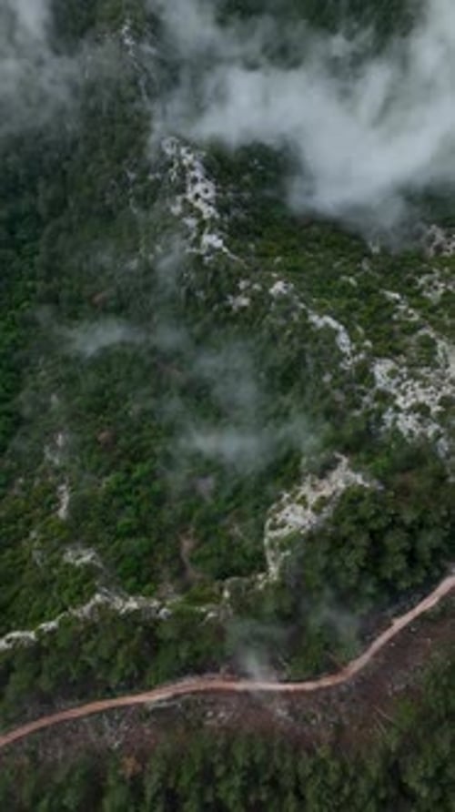 Vertical Video Mountain Oasis in Spring Aerial Perspective of a Stunning Lake