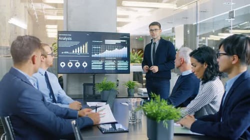 Business team meeting with analysis presentation