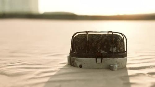 Old Rusted Trash on the Sand Beach