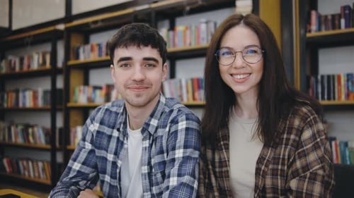 Smiling Students in a Library