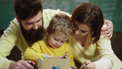 Happy Family Drawing Together with Markers