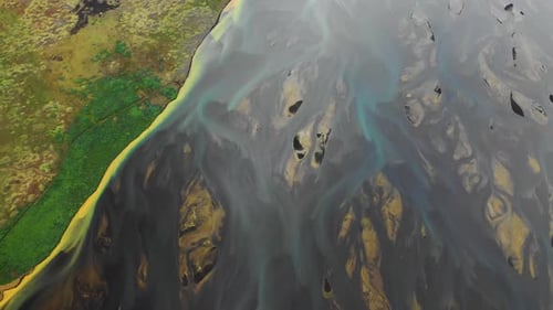 Aerial view of a river along the coast in Iceland.