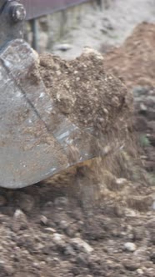 Excavator Trench Stone Excavator Digs Stone to Create Trench on Road for New Water Plastic Pipe