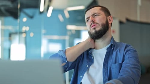 Adult Worker Experiences Neck Pain and Discomfort in Office