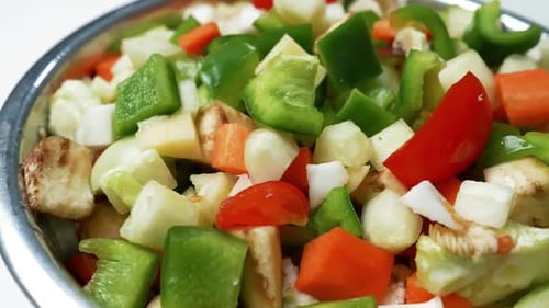 Chopped Fresh Vegetables in a Bowl, A close-up of a bowl filled with chopped fresh vegetables