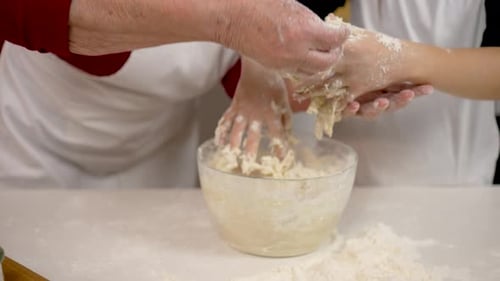 Close Up Shot Little Girl Kneading Dough in Flour in Bowl Yeast Mass Sticks to the Hands Elderly