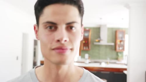 Man Smiling in Modern Home Kitchen