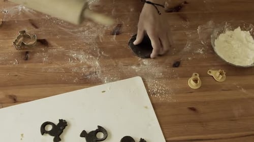 Rolling Dough to Make Festive Christmas Cookies