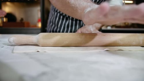 Chef in Professional Kitchen Prepares Pastry with Flour to Make Bread or Pasta