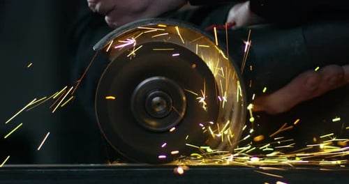Sparks Fly From Metal Grinder At Work