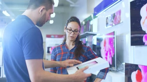 In the Electronics Store Professional Consultant Provides Expert Advice on Tablet Computer Specific