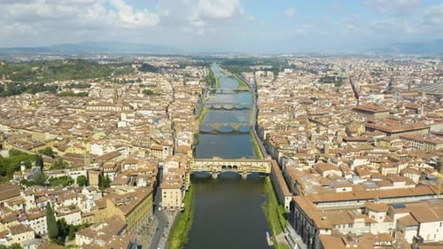 Cinematic Establishing Shot of Ponte Vecchio above the Arno River in Florence, Italy