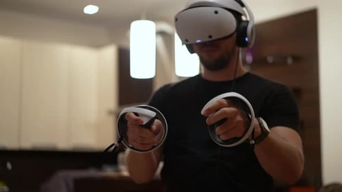 Young Adult Plays VR Game with Headset