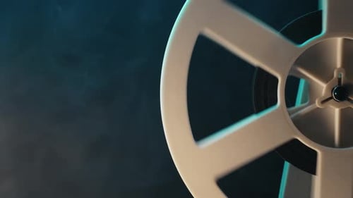 Vintage Film Reel Spinning on Black Background