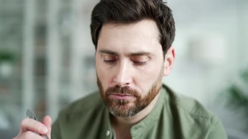 Bearded Man Eats Salad Close Up