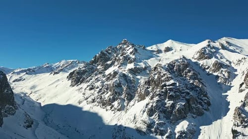 Snowy Mountains Against Clear Blue Sky