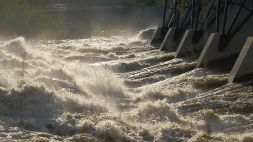 Waters browned out of hydro dam. very dirty water overflows from the fields and mountains out of the