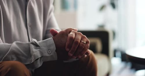 Senior Adult Fidgeting His Hands Indoors