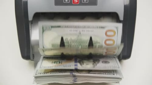 Money Counter Processes One Hundred Dollar Bills
