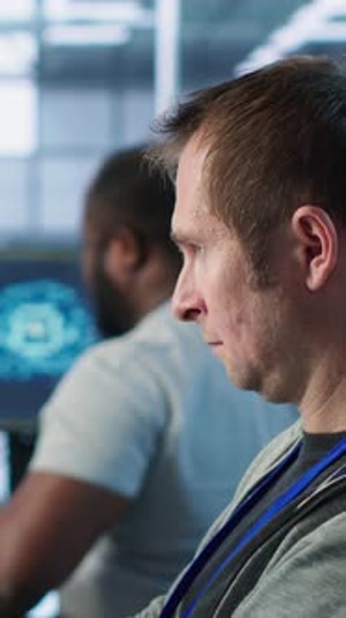 Programmer Requesting Help From Manager While Working on Computer in Data Center