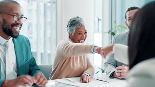 Business Team Laughing at Meeting at Work