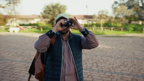 Photographer Taking Picture To The Trees At The Park