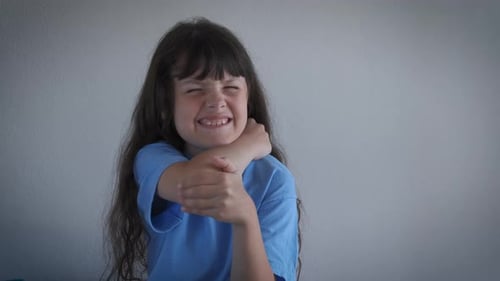 Child Scratching Itchy Arm